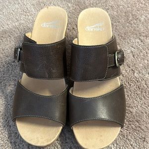Size 39/8.5 brown wedge Dansko slides.  Great condition, worn once.